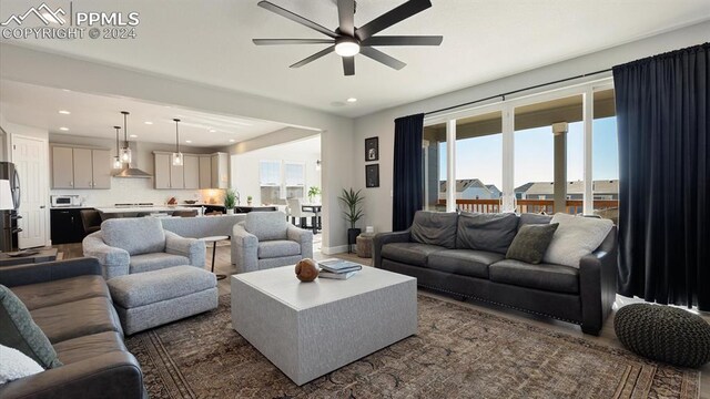 living room with ceiling fan