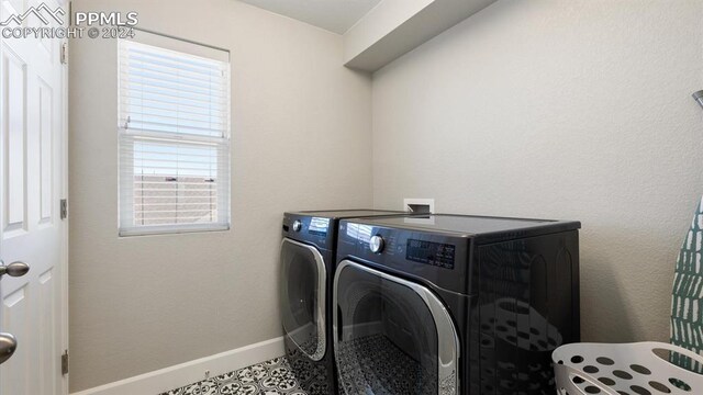 laundry area with separate washer and dryer