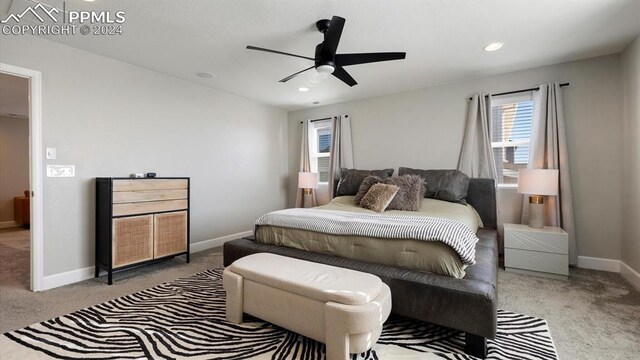 carpeted bedroom with ceiling fan