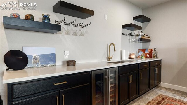 bar featuring wine cooler and sink