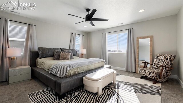 carpeted bedroom with ceiling fan