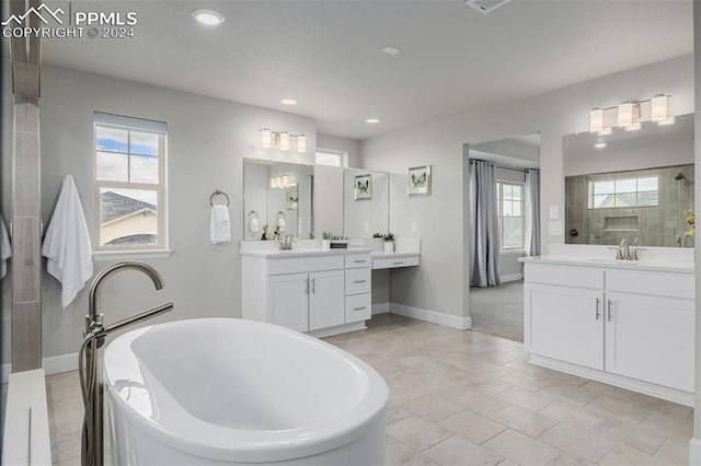 bathroom featuring vanity and separate shower and tub