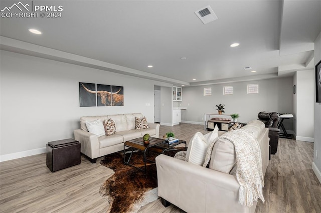 living room with light hardwood / wood-style flooring