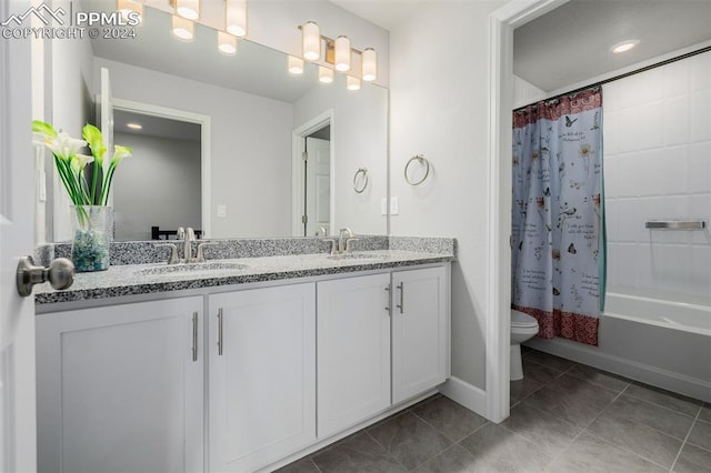 full bathroom with tile patterned flooring, vanity, shower / bath combination with curtain, and toilet