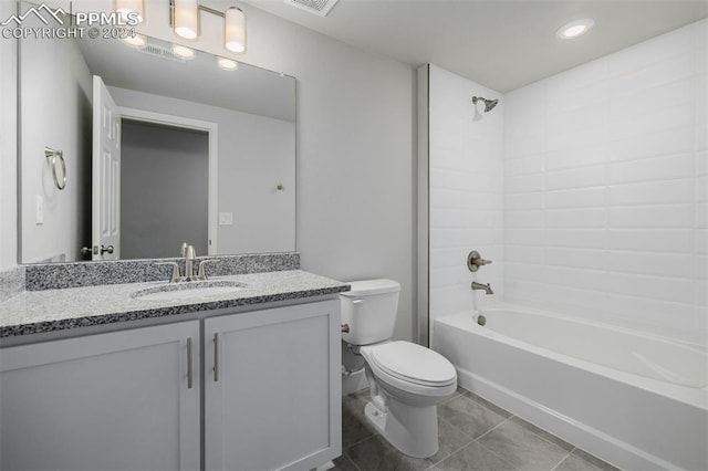 full bathroom with vanity,  shower combination, toilet, and tile patterned flooring