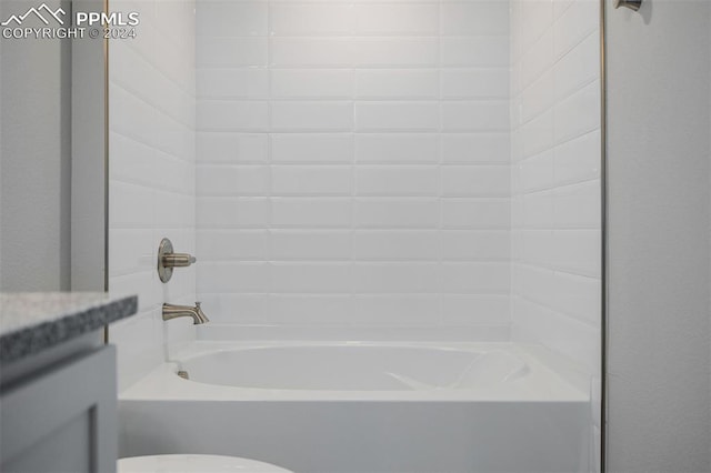 bathroom featuring shower / bath combination and toilet