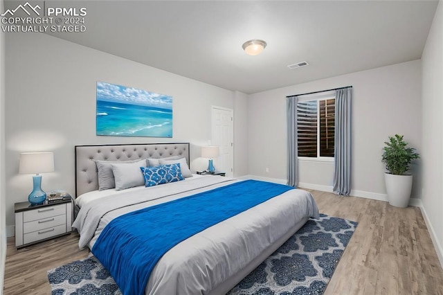 bedroom featuring light wood-type flooring