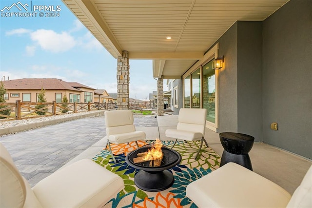 view of patio featuring an outdoor fire pit