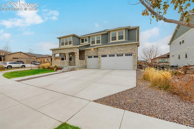 view of front of home featuring a porch and a garage