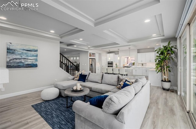 living room with beamed ceiling, light hardwood / wood-style floors, and coffered ceiling