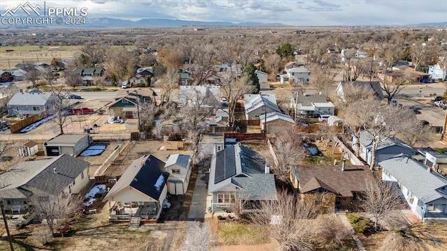 birds eye view of property with a mountain view