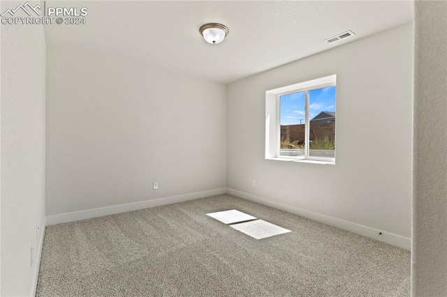 unfurnished room with carpet floors