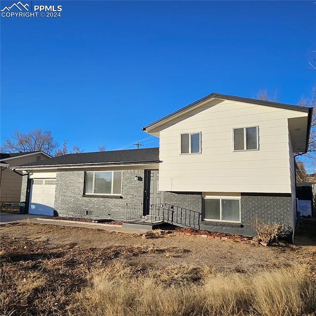 split level home with a garage