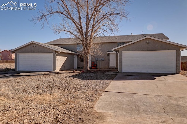 ranch-style house featuring a garage