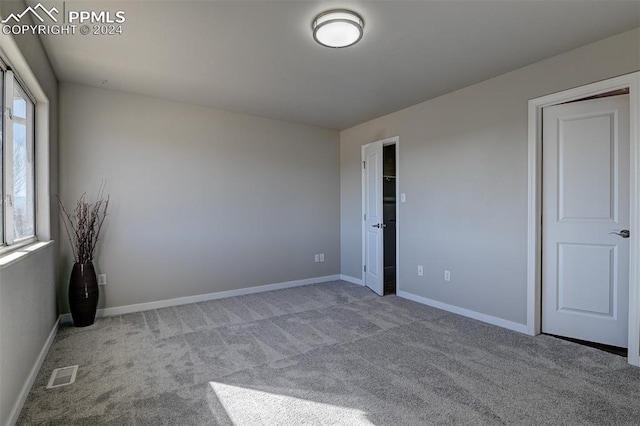 empty room with light colored carpet