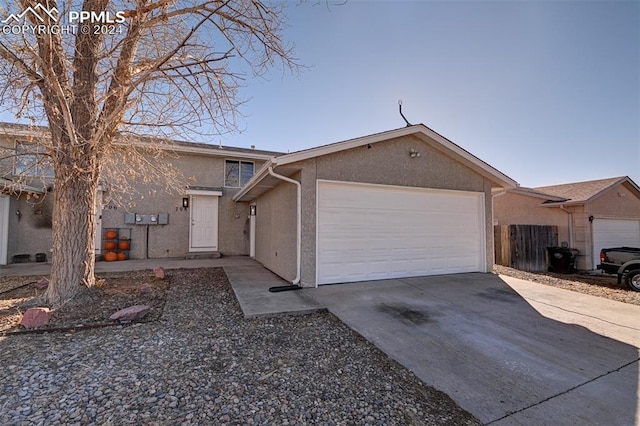 single story home featuring a garage