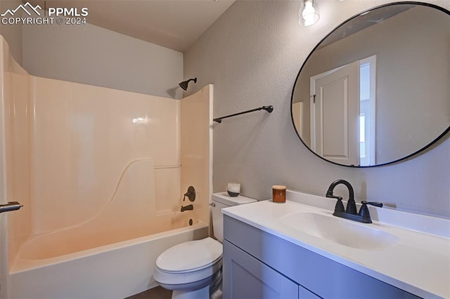 full bathroom with vanity, shower / bath combination, and toilet