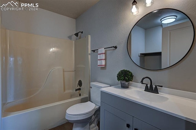 full bathroom with vanity, shower / bathtub combination, and toilet