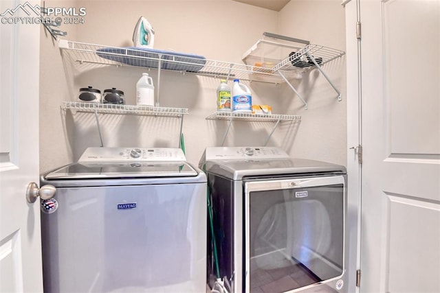 laundry room with separate washer and dryer