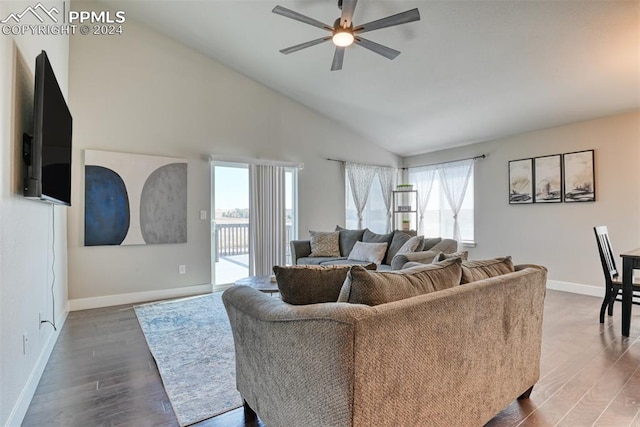 living room featuring high vaulted ceiling, plenty of natural light, dark hardwood / wood-style floors, and ceiling fan