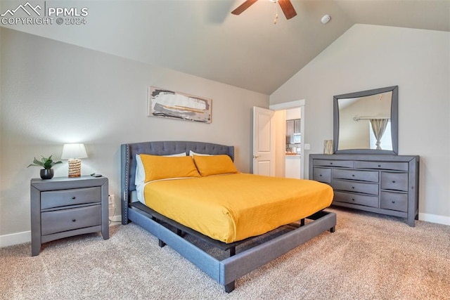 carpeted bedroom featuring vaulted ceiling and ceiling fan