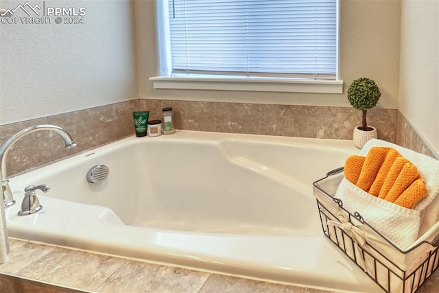 bathroom featuring tiled bath