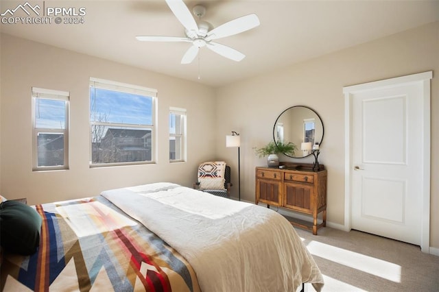 bedroom featuring ceiling fan and light colored carpet