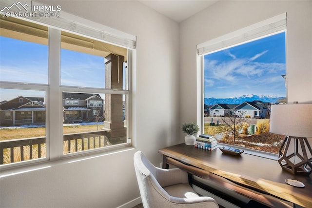 office space featuring a mountain view and a healthy amount of sunlight