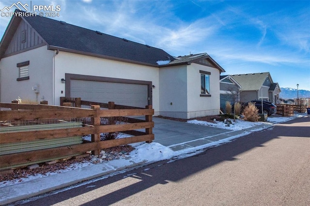 single story home featuring a garage