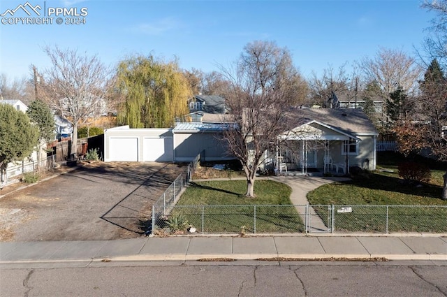 view of front facade with a front yard and a garage