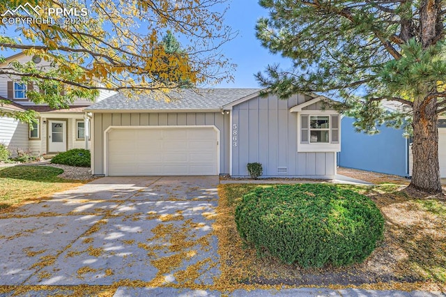 ranch-style house featuring a garage