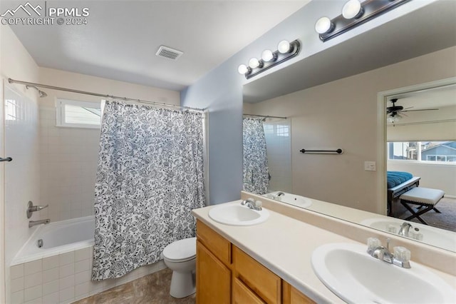 full bathroom featuring shower / bath combo, tile patterned floors, vanity, ceiling fan, and toilet