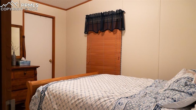 920 E 14th St, La Junta, CO 81050 - bedroom with crown molding