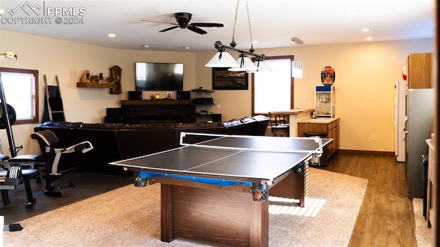 920 E 14th St, La Junta, CO 81050 - rec room featuring ceiling fan and hardwood / wood-style flooring