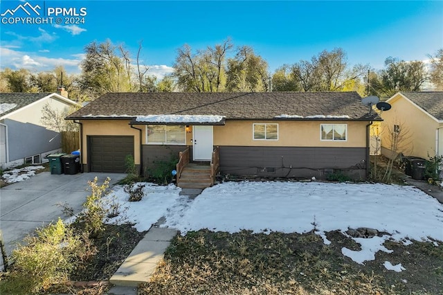 ranch-style home with a garage