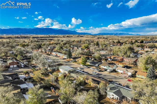 birds eye view of property featuring a mountain view