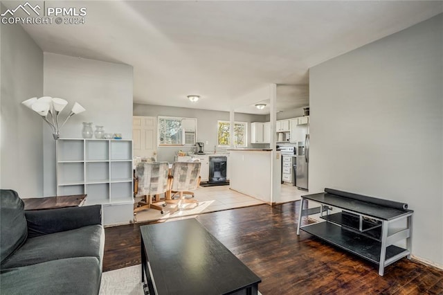 living room featuring wine cooler and light wood-type flooring