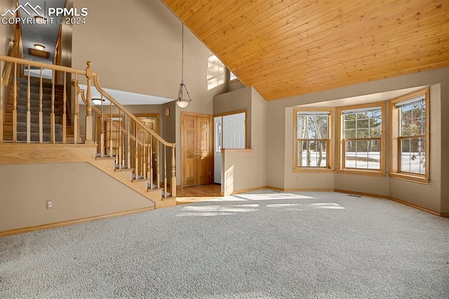 unfurnished living room featuring carpet flooring, high vaulted ceiling, and wood ceiling