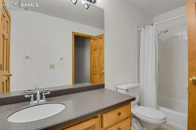 full bathroom with vanity, toilet, and shower / bath combo with shower curtain