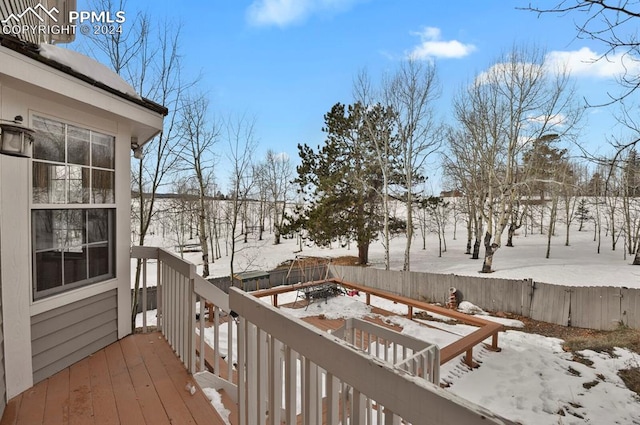 view of snow covered deck