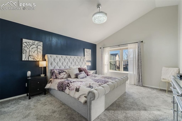 carpeted bedroom featuring vaulted ceiling