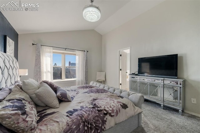 bedroom with carpet flooring, lofted ceiling, and a chandelier