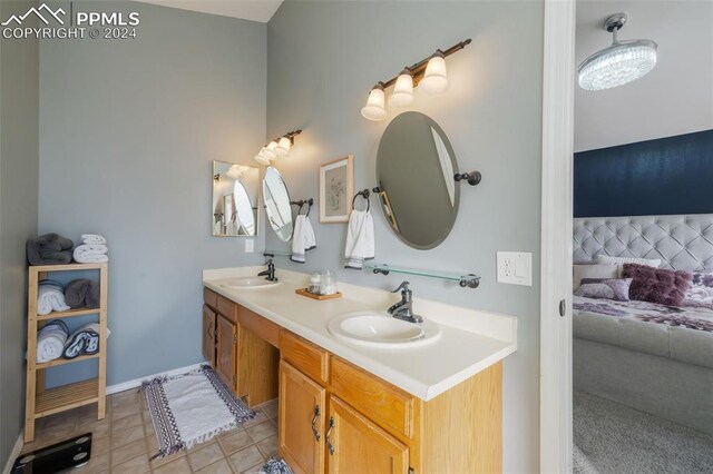 bathroom featuring tile patterned flooring and vanity