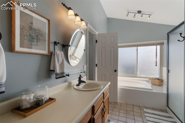 bathroom featuring tile patterned flooring, vanity, and independent shower and bath