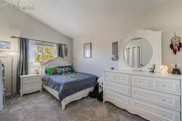 carpeted bedroom with lofted ceiling