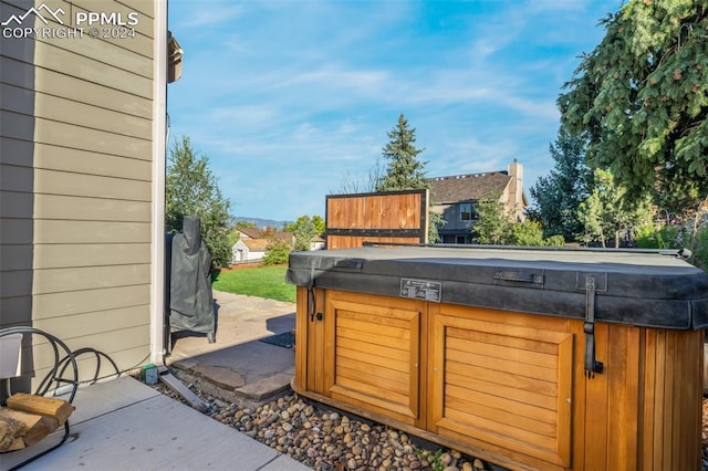 view of patio / terrace with a hot tub