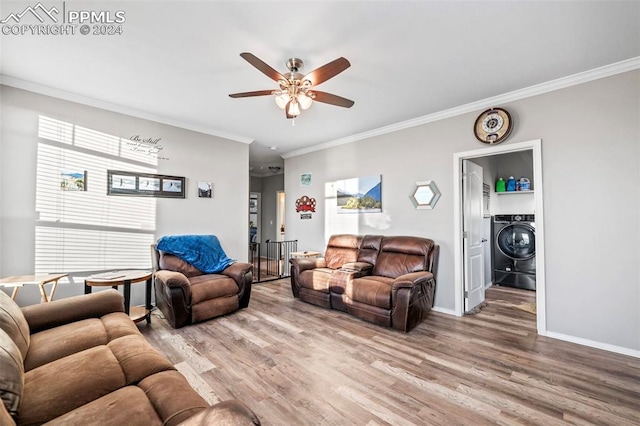 living room featuring hardwood / wood-style floors, a wealth of natural light, and washer / clothes dryer