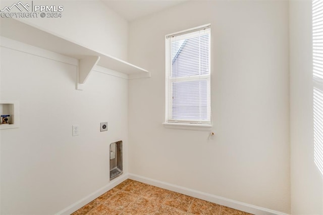 laundry room featuring washer hookup, light tile patterned floors, and electric dryer hookup