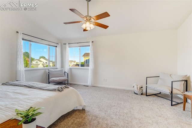 carpeted bedroom with ceiling fan and lofted ceiling