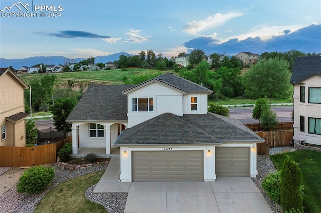 view of front of home featuring a mountain view